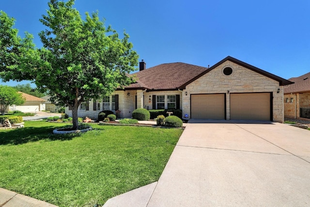 view of front of home featuring a garage and a front lawn