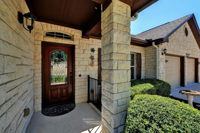 view of exterior entry featuring a garage