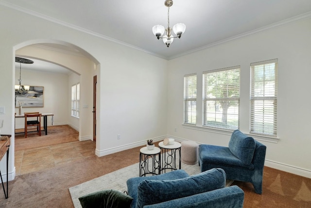 sitting room featuring light colored carpet, crown molding, and a notable chandelier