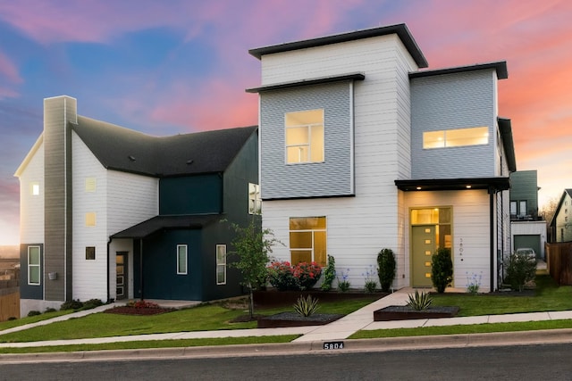 contemporary house featuring a lawn