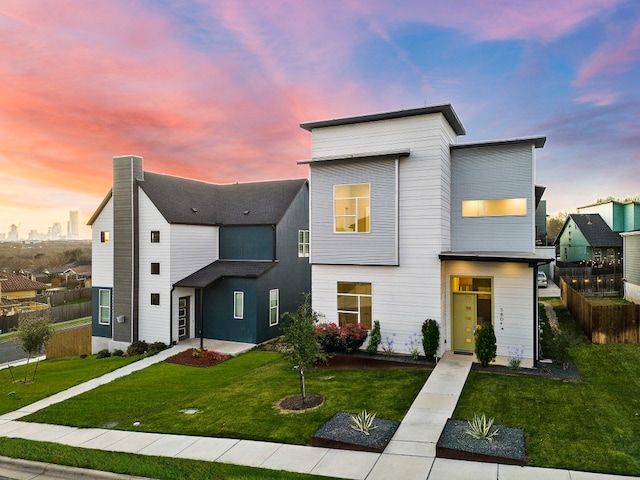 modern home featuring a lawn