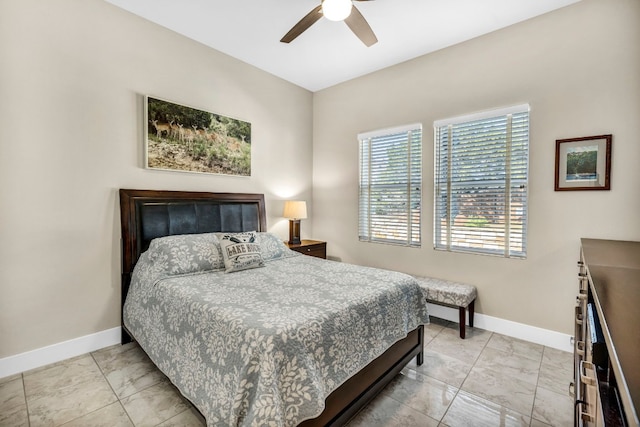 tiled bedroom with ceiling fan