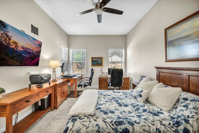 tiled bedroom featuring ceiling fan