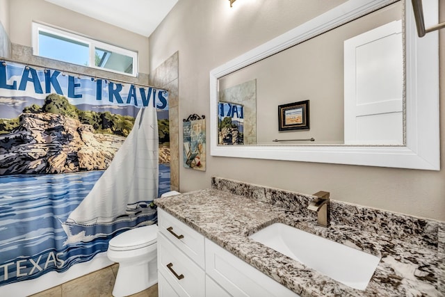 bathroom with toilet, tile flooring, and large vanity