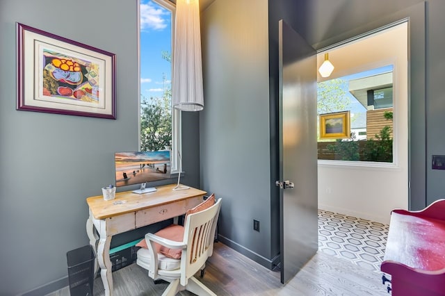 office space featuring wood-type flooring and plenty of natural light