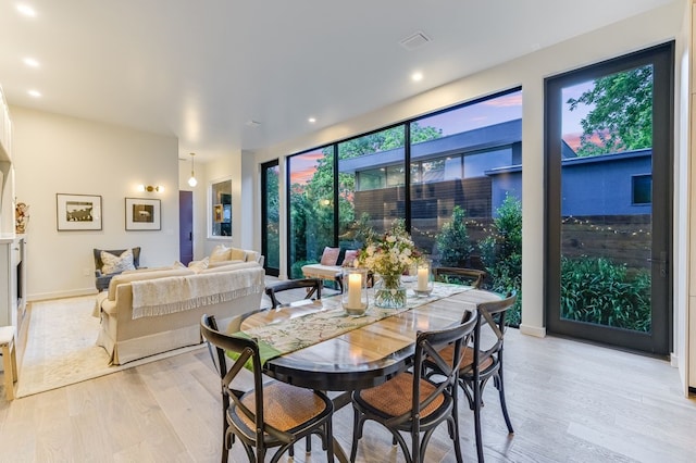 dining area featuring light wood-type flooring