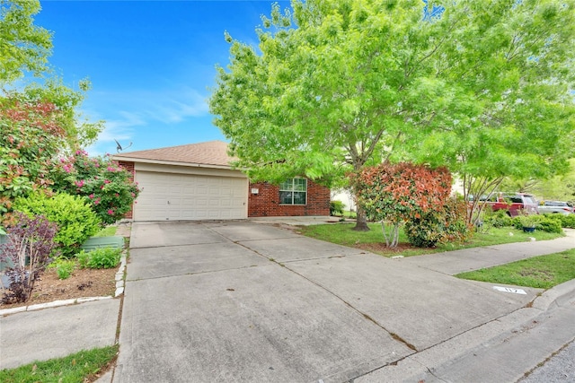 obstructed view of property with a garage