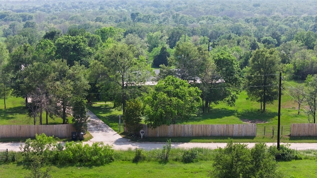 view of property's community featuring a lawn