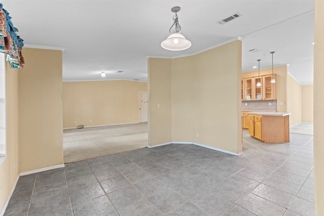 tiled spare room featuring ornamental molding