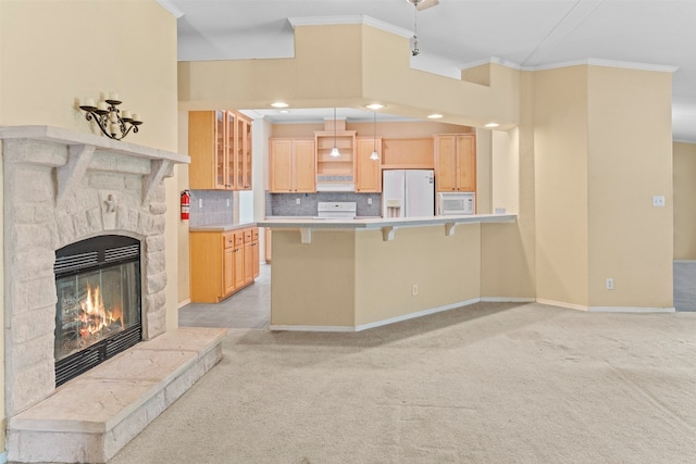 kitchen with a fireplace, light brown cabinetry, white appliances, light colored carpet, and crown molding