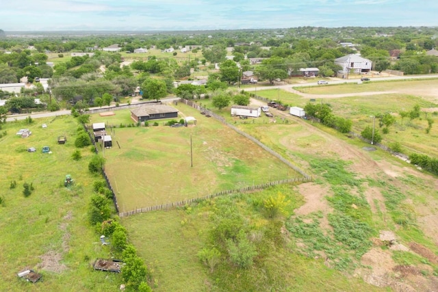 birds eye view of property with a rural view