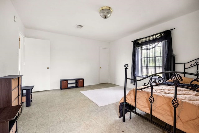 bedroom featuring light tile floors