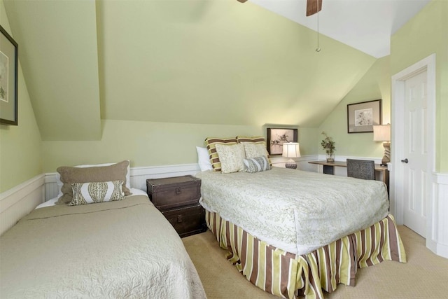 bedroom featuring light carpet, lofted ceiling, and ceiling fan