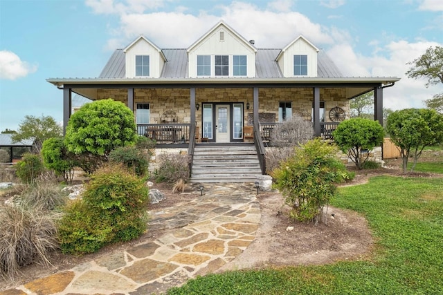 country-style home featuring covered porch