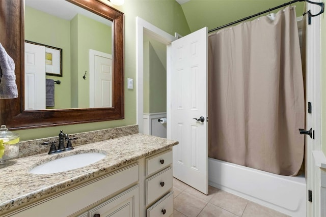 bathroom with shower / bath combo with shower curtain, vanity, and tile flooring