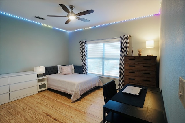 bedroom featuring ceiling fan and light hardwood / wood-style floors