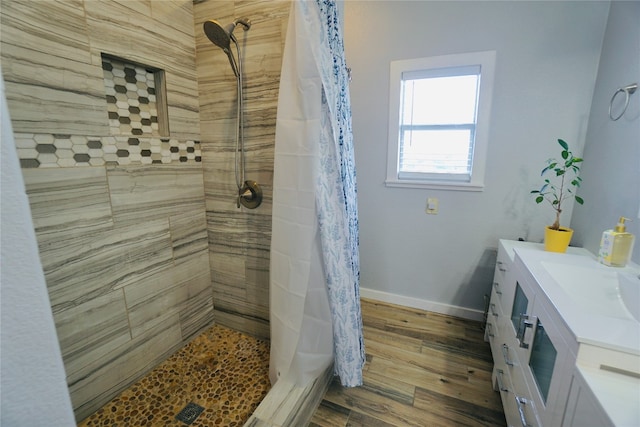 bathroom with vanity, a shower with shower curtain, and hardwood / wood-style flooring