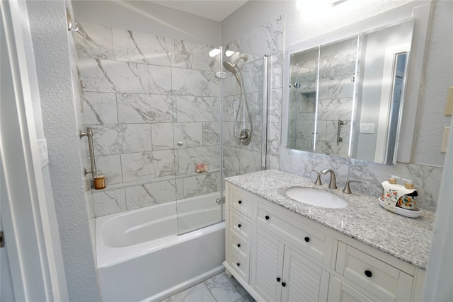 bathroom featuring vanity, tile patterned flooring, and tiled shower / bath combo