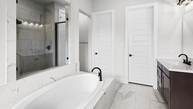 bathroom with vanity and separate shower and tub