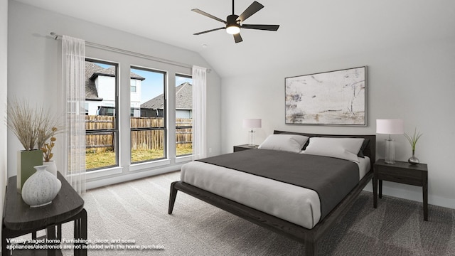 carpeted bedroom with lofted ceiling and ceiling fan