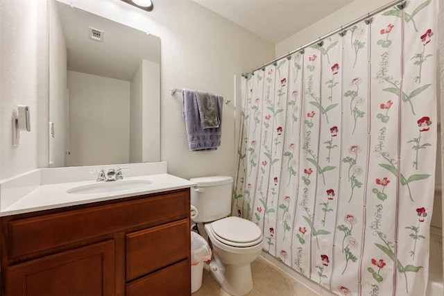 full bathroom featuring vanity, visible vents, curtained shower, tile patterned floors, and toilet