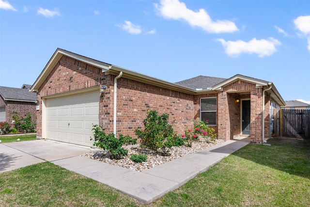 ranch-style house with a garage and a front lawn