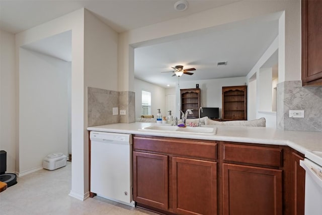 kitchen with visible vents, a sink, light countertops, dishwasher, and ceiling fan