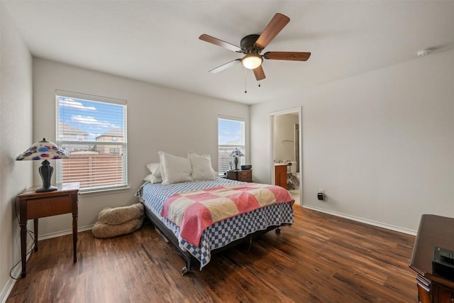 bedroom with ceiling fan, baseboards, wood finished floors, and ensuite bathroom