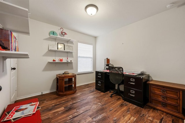 office space with dark wood finished floors and baseboards