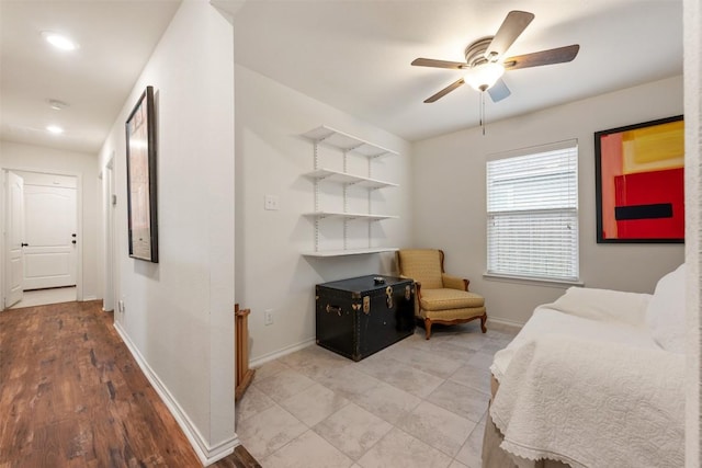 bedroom featuring baseboards and a ceiling fan