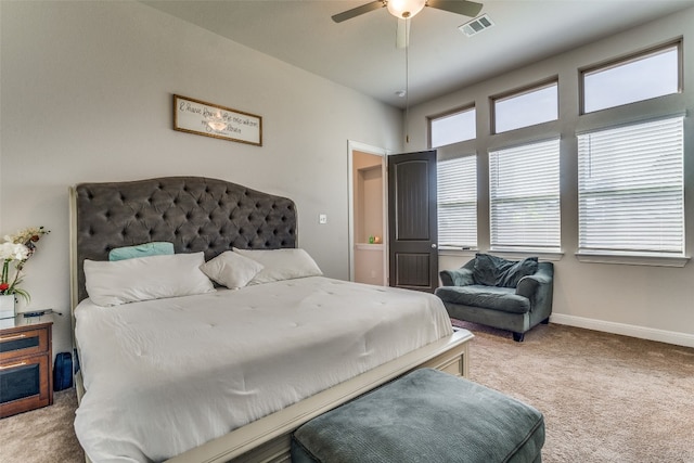 bedroom featuring light colored carpet and ceiling fan