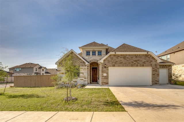 view of front of house with a front lawn and a garage