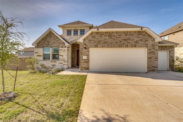 view of front of home featuring a front lawn and a garage