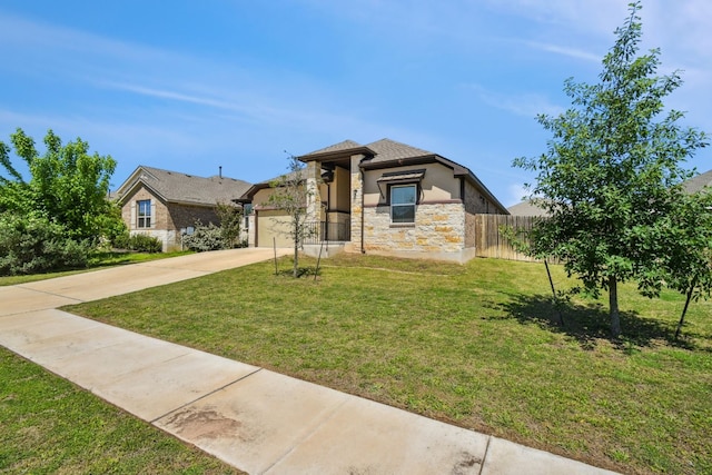 view of front facade with a garage and a front yard