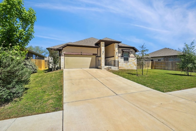 prairie-style house featuring a garage and a front lawn