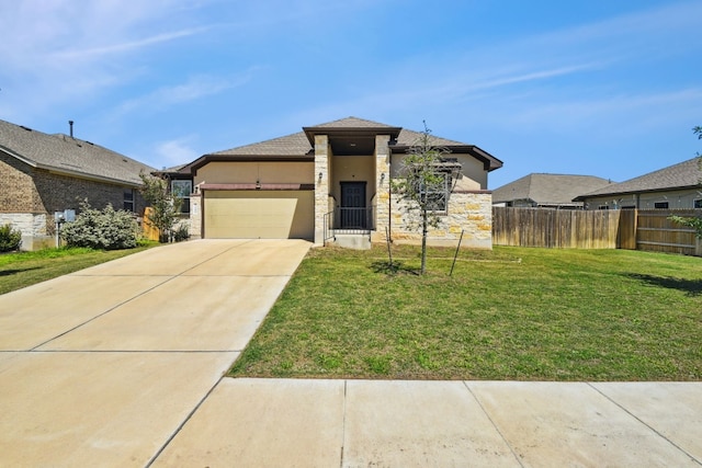 view of front of house featuring a front yard and a garage