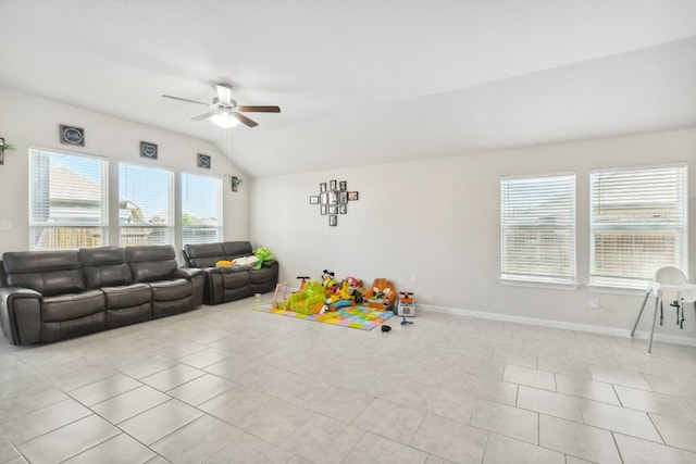 recreation room featuring lofted ceiling, ceiling fan, and light tile flooring