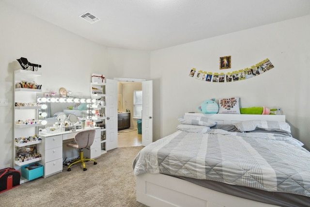 tiled bedroom featuring connected bathroom