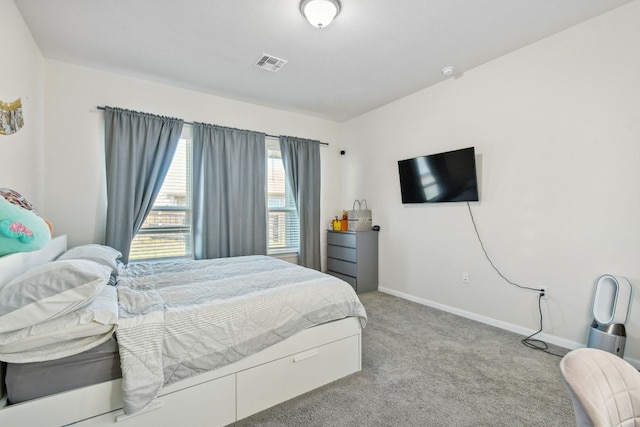 bedroom with light colored carpet