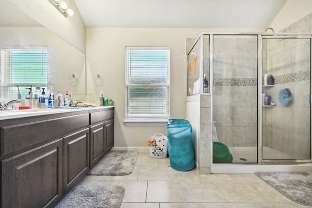 bathroom featuring walk in shower, tile floors, and vanity