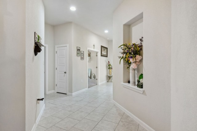 hallway featuring light tile floors