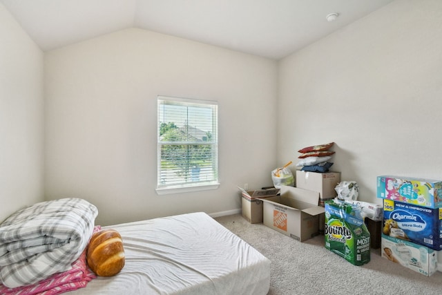 carpeted bedroom with vaulted ceiling