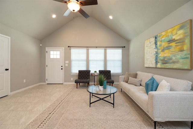 living room with high vaulted ceiling, ceiling fan, and light tile floors