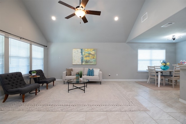 living room featuring high vaulted ceiling, ceiling fan, and light tile floors