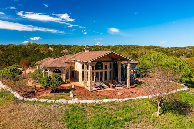 back of house with a patio