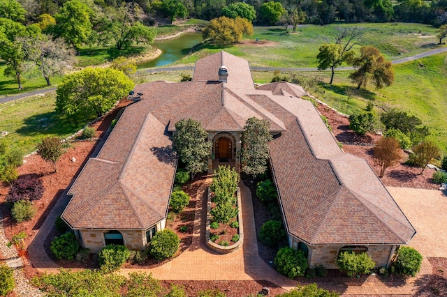 birds eye view of property with a water view