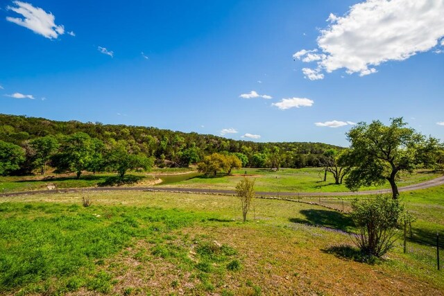 view of yard with a rural view