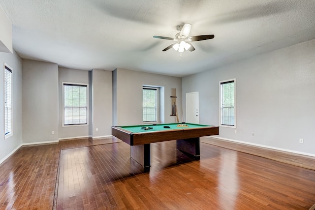 game room featuring a textured ceiling, ceiling fan, pool table, and wood-type flooring