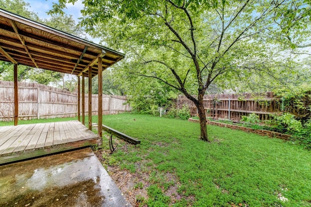 view of yard with a wooden deck