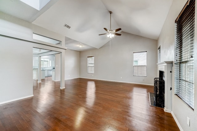 unfurnished living room featuring high vaulted ceiling, ceiling fan, and dark hardwood / wood-style floors